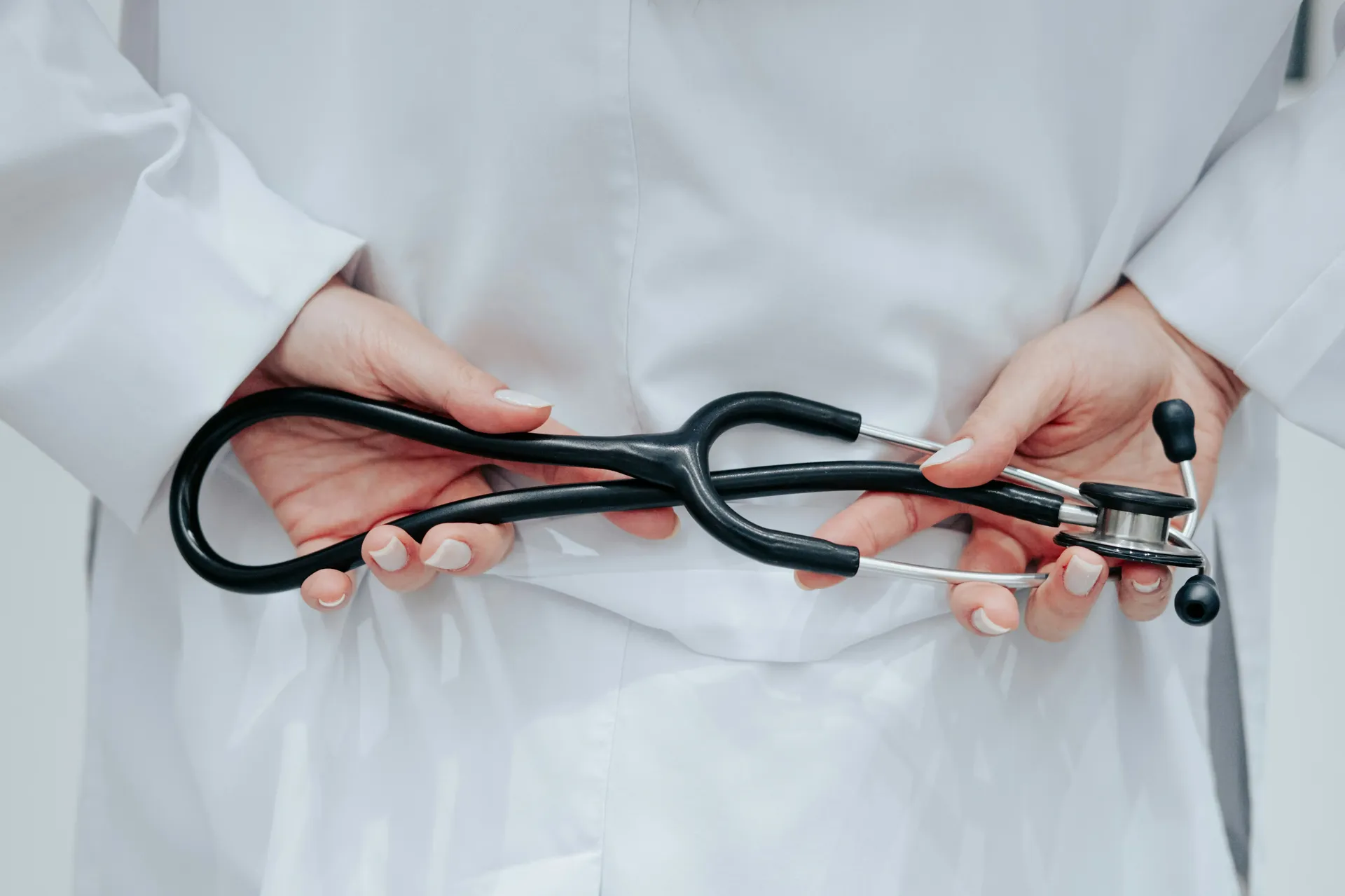 Medical scissors in doctor's hands